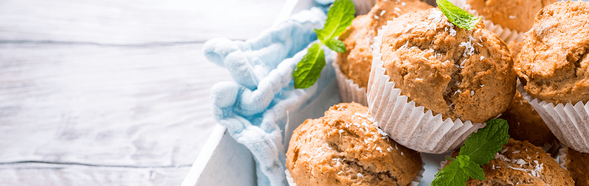 Gluten Free Cupcakes with mint leaves on a white background