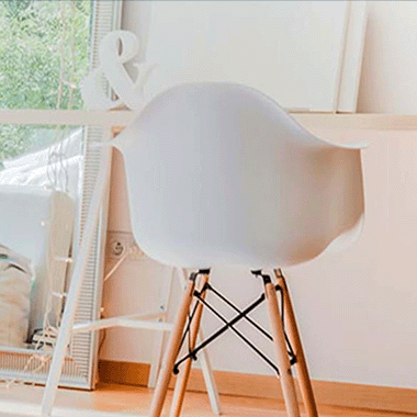white chair, desk and a mirror with a white frame showing range of consumer based products that the consumer products standard can cover